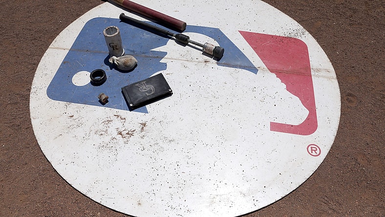 Aug 11, 2016; Arlington, TX, USA; A general view of the MLB logo with Colorado Rockies batting gear on it during the game against the Texas Rangers at Globe Life Park in Arlington. Colorado Rockies won 12-9. Mandatory Credit: Tim Heitman-USA TODAY Sports