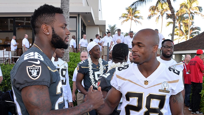 Caption: Jan 29, 2016; Kahuku, HI, USA; Oakland Raiders running back Latavius Murray (left) and Minnesota Vikings running back Adrian Peterson (28) during 2016 Pro Bowl photo day at Turtle Bay Resort. Mandatory Credit: Kirby Lee-USA TODAY Sports
