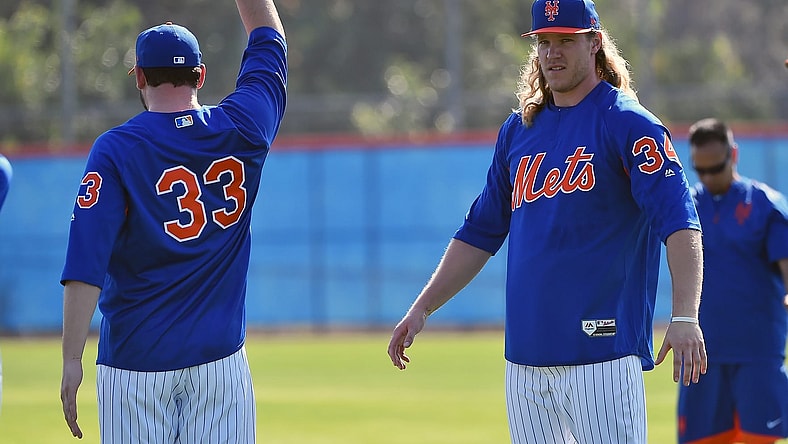 Feb 14, 2017; Port St. Lucie, FL, USA; New York Mets starting pitcher Matt Harvey (33) and starting pitcher Noah Syndergaard (34) stretch during spring training workouts at Tradition Field. Mandatory Credit: Jasen Vinlove-USA TODAY Sports