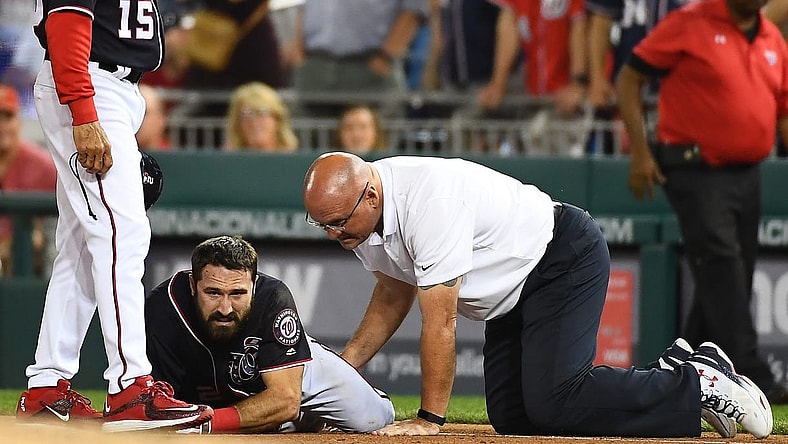 pr 28, 2017; Washington, DC, USA; Washington Nationals center fielder Adam Eaton (2) is looked at by a trainer after suffering an apparent leg injury during the ninth inning against the New York Mets at Nationals Park. Mandatory Credit: Brad Mills-USA TODAY Sports