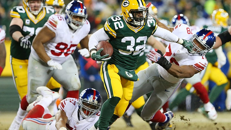 Jan 8, 2017; Green Bay, WI, USA; Green Bay Packers running back Christine Michael (32) stiff arms New York Giants defensive end Romeo Okwara (78) during the third quarter in the NFC Wild Card playoff football game at Lambea