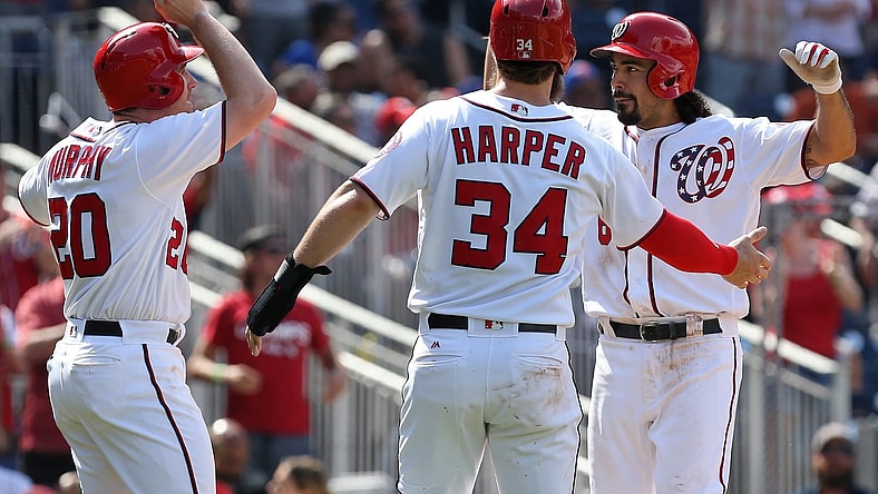 Caption: Apr 30, 2017; Washington, DC, USA; Washington Nationals third baseman Anthony Rendon (6) celebrates with Nationals second baseman Daniel Murphy (20) and Nationals right fielder Bryce Harper (34) after hitting a three-run home run against the New York Mets in the fourth inning at Nationals Park. Mandatory Credit: Geoff Burke-USA TODAY Sports