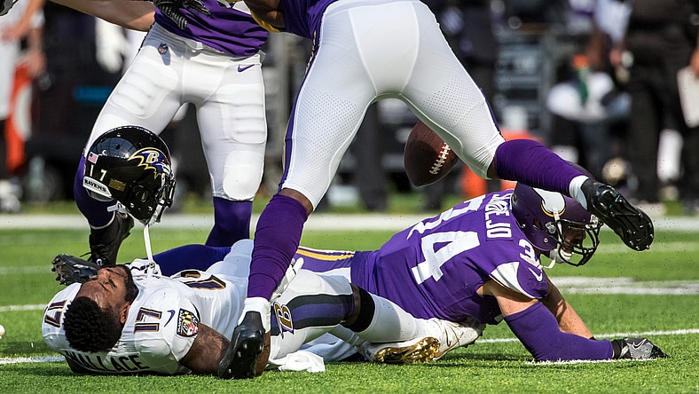 Vikings safety Andrew Sendejo hits Ravens receiver Mike Wallace