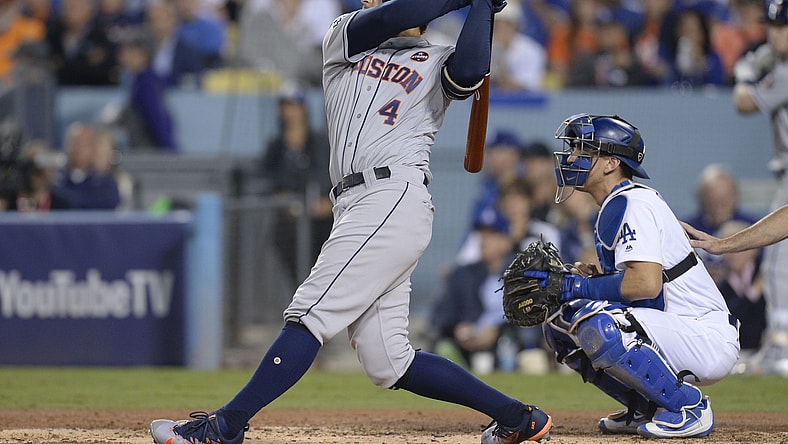 Houston Astros center fielder George Springer hits a solo home run against the Los Angeles Dodgers in the third inning in game six of the 2017 World Series at Dodger Stadium.