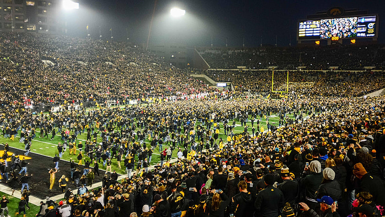 Iowa fans charge the field after the Hawkeyes beat Ohio State in college football Week 10