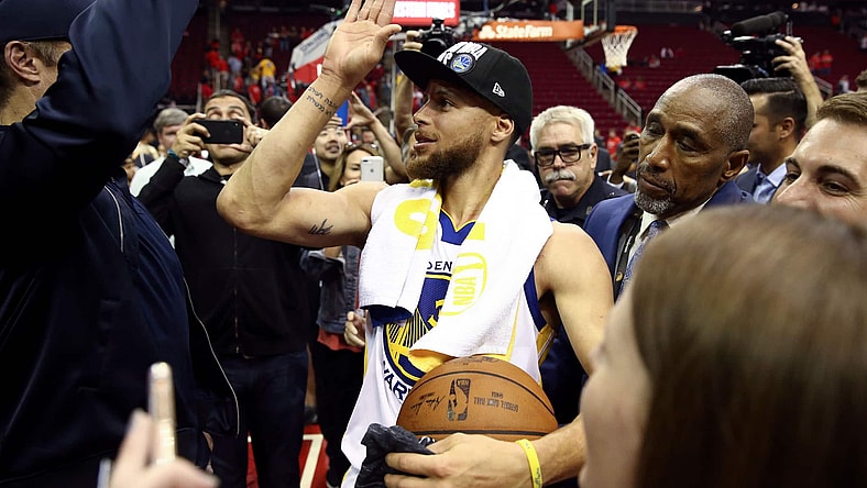 May 28, 2018; Houston, TX, USA; Golden State Warriors guard Stephen Curry (30) high fives a fan after defeating the Houston Rockets in game seven of the Western conference finals of the 2018 NBA Playoffs at Toyota Center. Mandatory Credit: Troy Taormina-USA TODAY Sports