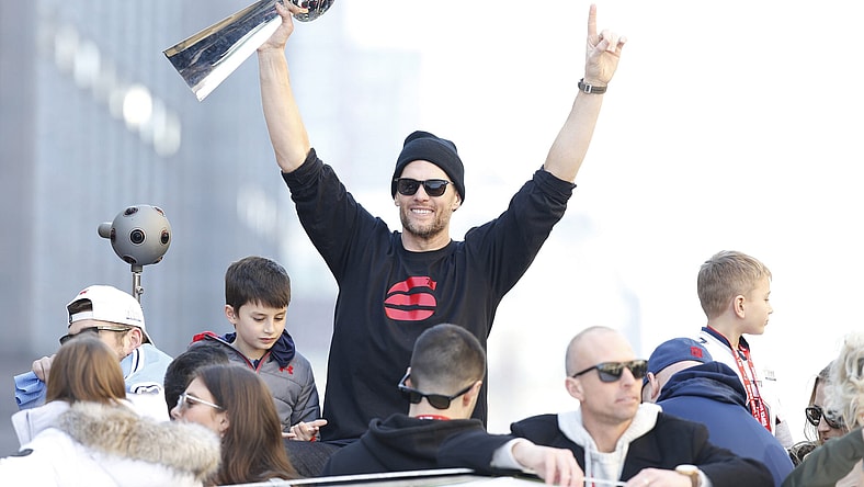 Tom Brady holds the Lombardi Trophy