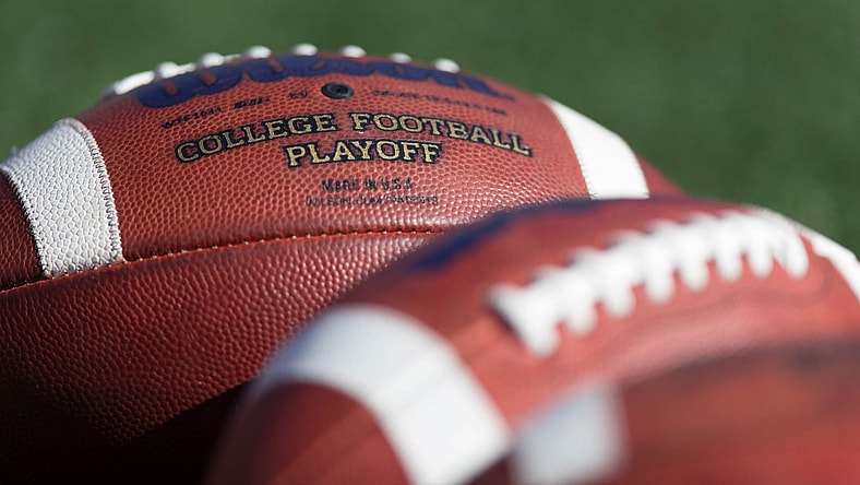 College footballs on field before game