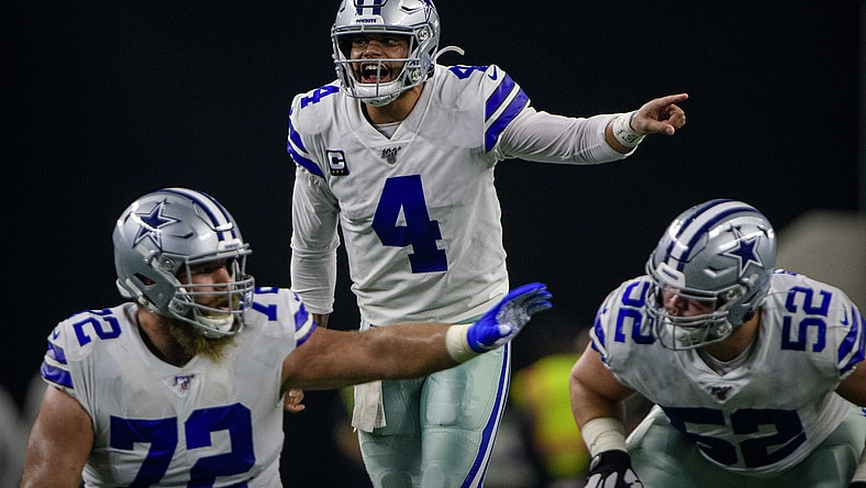 Dak Prescott calls a play at the line