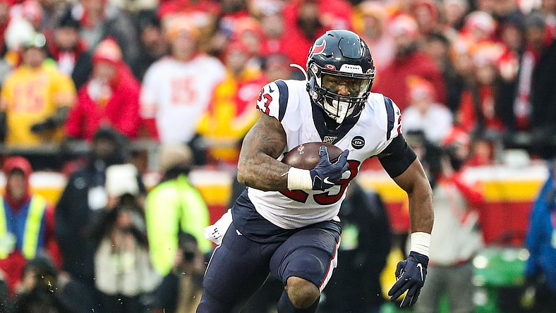 Carlos Hyde runs the ball against the Chiefs in an NFL Playoff game.