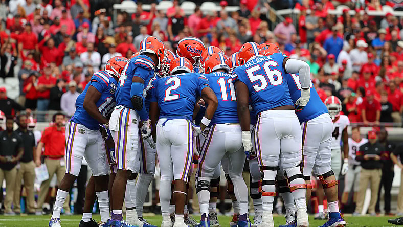 Florida Gators football players huddle