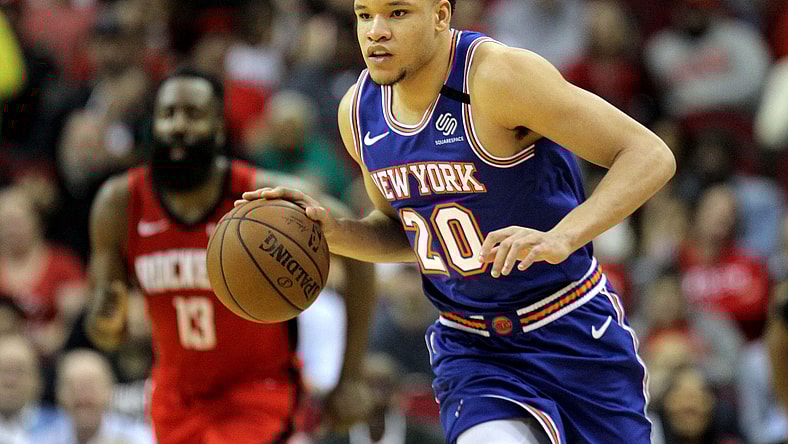 Knicks forward Kevin Knox dribbles the ball against the Rockets.