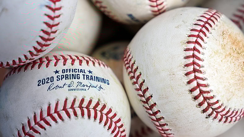 MLB baseballs in bucket
