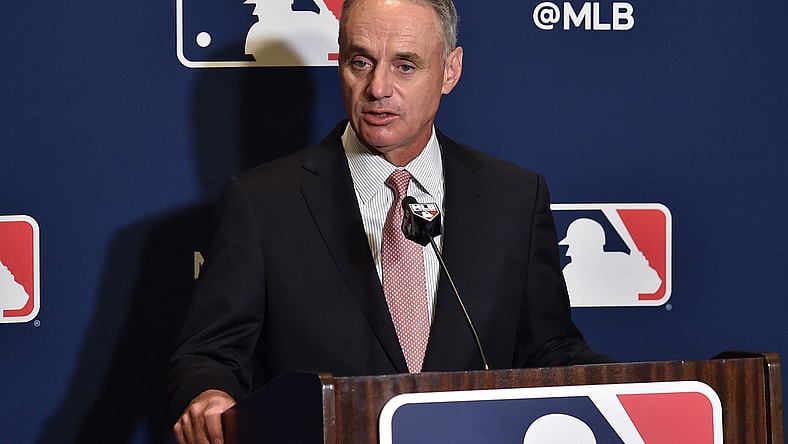 MLB commissioner Rob Manfred speaks to reporters