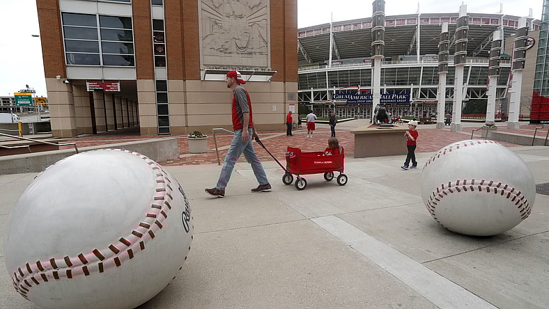 Cincinnati Reds fan walks outside Great American Ballpark on what would have been MLB 2020 opening day.