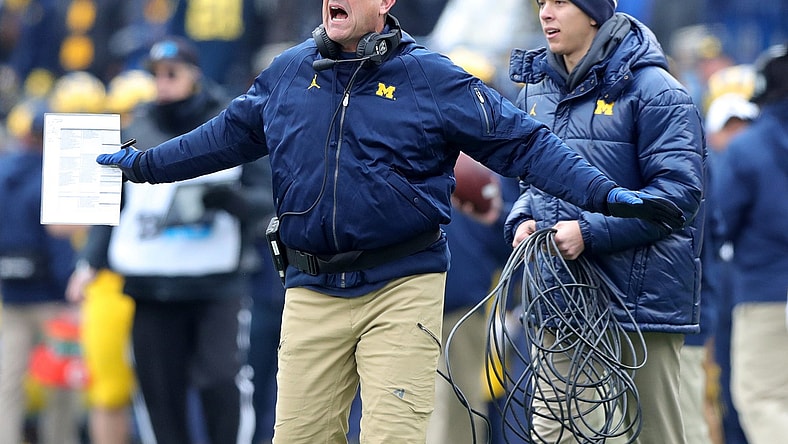 Michigan coach Jim Harbaugh reacts during game