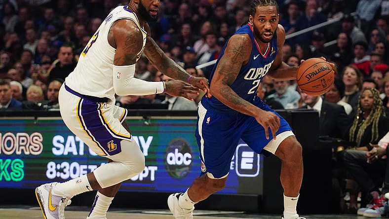LeBron James guards Kawhi Leonard