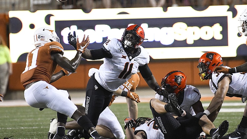 Oklahoma State Cowboys linebacker Amen Ogbongbemiga has COVID-19