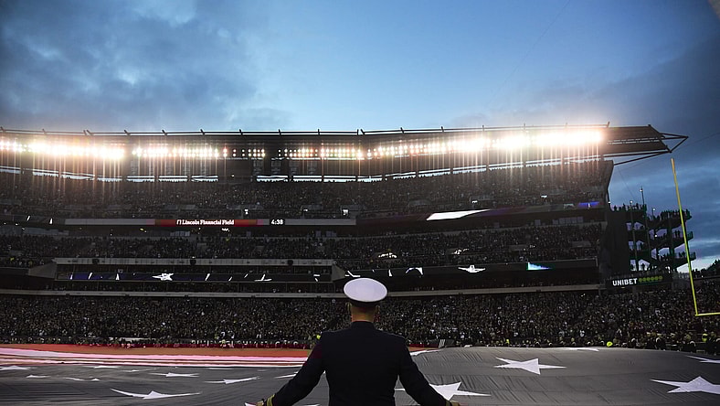 United States flag presented before NFL Playoff game.