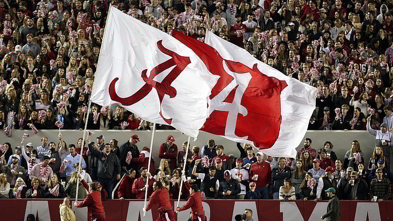 Alabama Crimson Tide flags wave during football game