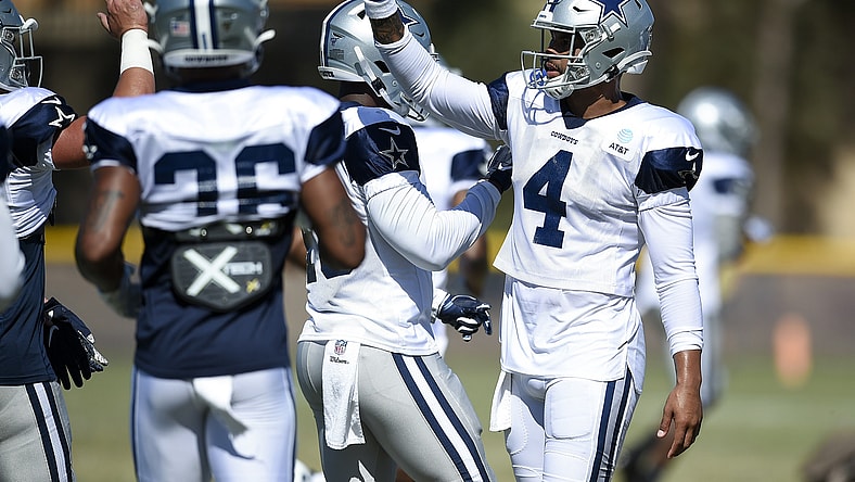 Dallas Cowboys players huddle during training camp