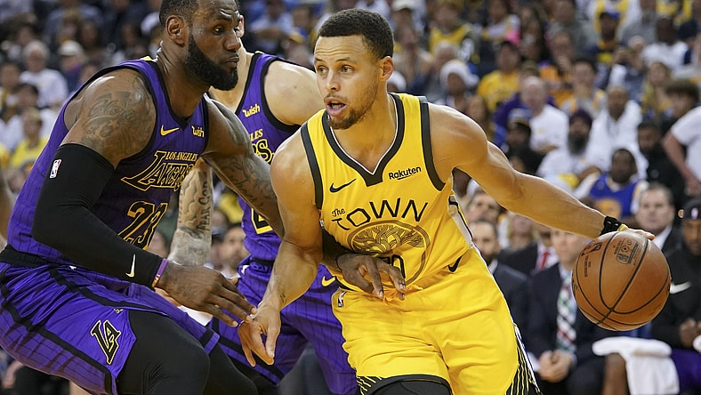 Warriors Stephen Curry goes up against Lakers' LeBron James
