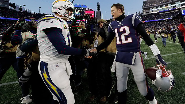 Tom Brady and Philip Rivers shake hands after NFL Playoff game.