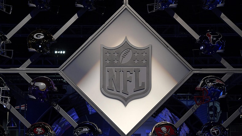 NFL shield logo and helmets at Super Bowl