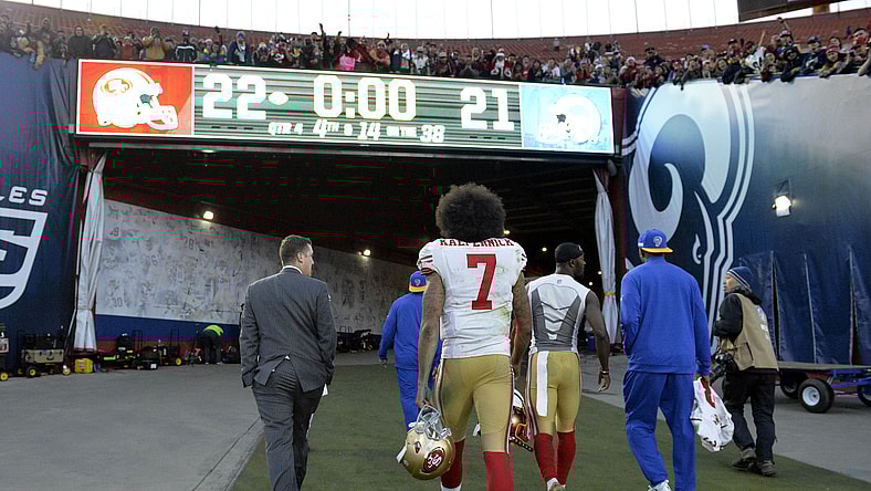 NFL quarterback Colin Kaepernick walks off the field