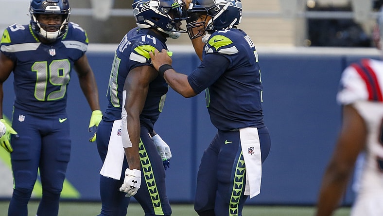 Seahawks Russell Wilson and D.K. Metcalf during NFL game against the Patriots