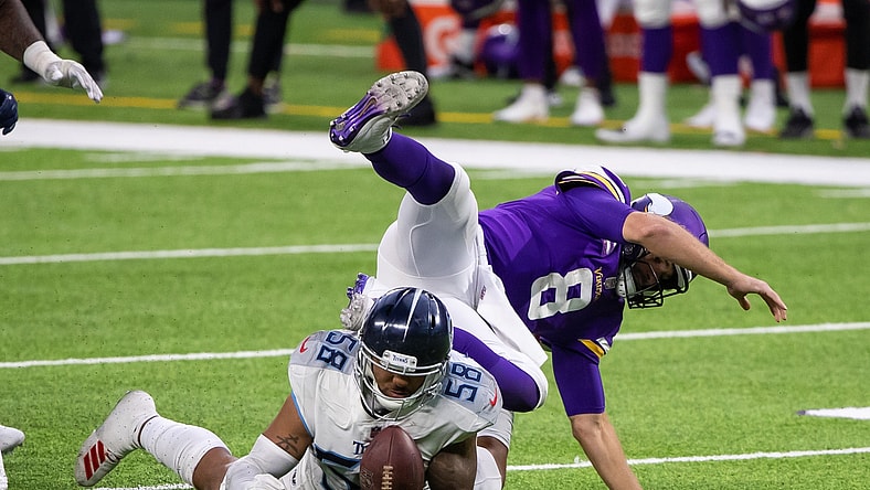 Sep 27, 2020; Minneapolis, Minnesota, USA; Tennessee Titans linebacker Harold Landry (58) tries to recover the Minnesota Vikings quarterback Kirk Cousins (8) fumble in the fourth quarter at U.S. Bank Stadium. Mandatory Credit: Brad Rempel-USA TODAY Sports