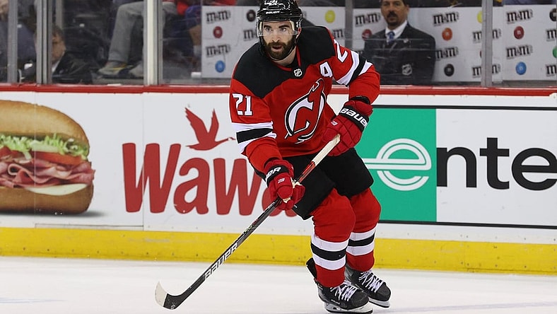 Mar 10, 2020; Newark, New Jersey, USA; New Jersey Devils right wing Kyle Palmieri (21) skates with the puck against the Pittsburgh Penguins during the second period at Prudential Center. Mandatory Credit: Ed Mulholland-USA TODAY Sports