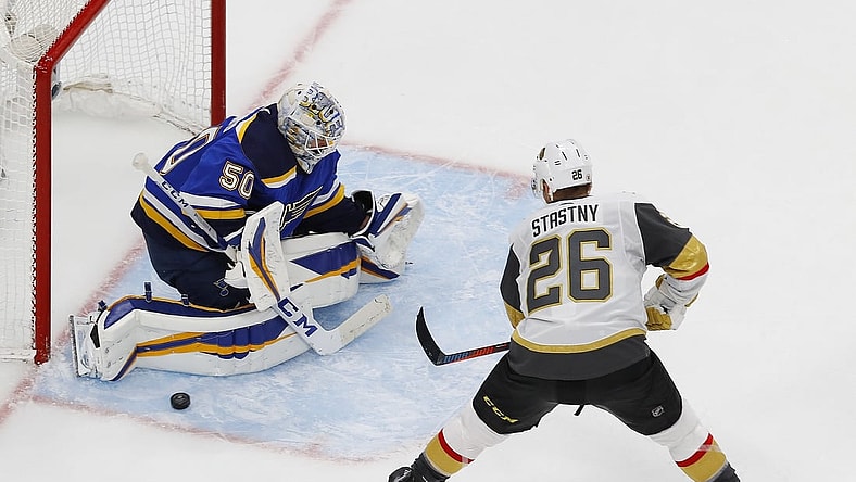 Aug 6, 2020; Edmonton, Alberta, CAN; St. Louis Blues goaltender Jordan Binnington (50) makes a save on Vegas Golden Knights forward Paul Stastny (26) during the third period of the Western Conference qualifications at Rogers Place. Mandatory Credit: Perry Nelson-USA TODAY Sports