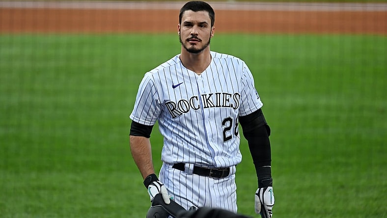 Sep 12, 2020; Denver, Colorado, USA; Colorado Rockies third baseman Nolan Arenado (28) reacts following his strikeout in the first inning against the Los Angeles Angels at Coors Field. Mandatory Credit: Ron Chenoy-USA TODAY Sports