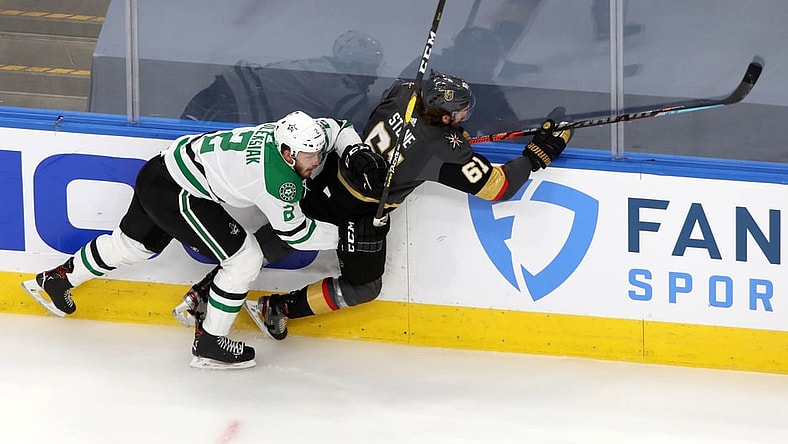 Sep 14, 2020; Edmonton, Alberta, CAN; Dallas Stars defenseman Jamie Oleksiak (2) checks Vegas Golden Knights right wing Mark Stone (61) during the second period in game five of the second round of the 2020 Stanley Cup Playoffs at Rogers Place. Mandatory Credit: Gerry Thomas-USA TODAY Sports