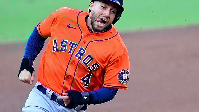 Oct 16, 2020; San Diego, California, USA; Houston Astros center fielder George Springer (4) rounds third base with his tongue out on his way to score against the Tampa Bay Rays on an RBI double hit by second baseman Jose Altuve (not pictured) during the fifth inning during game six of the 2020 ALCS at Petco Park. Mandatory Credit: Jayne Kamin-Oncea-USA TODAY Sports
