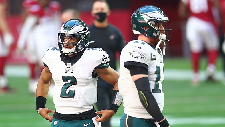 Dec 20, 2020; Glendale, Arizona, USA; Philadelphia Eagles quarterback Jalen Hurts (2) and Carson Wentz (11) against the Arizona Cardinals at State Farm Stadium. Mandatory Credit: Mark J. Rebilas-USA TODAY Sports