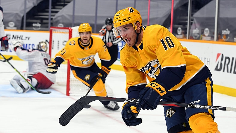 Jan 16, 2021; Nashville, Tennessee, USA; Nashville Predators center Colton Sissons (10) and right wing Viktor Arvidsson (33) celebrate after a goal against the Columbus Blue Jackets during the third period at Bridgestone Arena. Mandatory Credit: Christopher Hanewinckel-USA TODAY Sports
