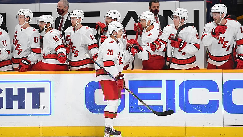 Jan 18, 2021; Nashville, Tennessee, USA; Carolina Hurricanes right wing Sebastian Aho (20) is congratulated by teammates after a goal during the third period against the Nashville Predators at Bridgestone Arena. Mandatory Credit: Christopher Hanewinckel-USA TODAY Sports