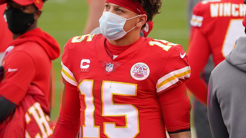Jan 17, 2021; Kansas City, Missouri, USA; Kansas City Chiefs quarterback Patrick Mahomes (15) watches play on the sidelines during the AFC Divisional Round playoff game against the Cleveland Browns at Arrowhead Stadium. Mandatory Credit: Denny Medley-USA TODAY Sports