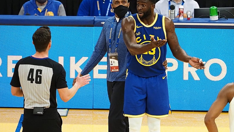 Jan 21, 2021; San Francisco, California, USA; Golden State Warriors forward Draymond Green (23) reacts as referee Ben Taylor (46) issues him a second technical to eject him from the game as security guard Ralph Walker tries to escort him off the court during the second quarter against the New York Knicks at Chase Center. Mandatory Credit: Kelley L Cox-USA TODAY Sports