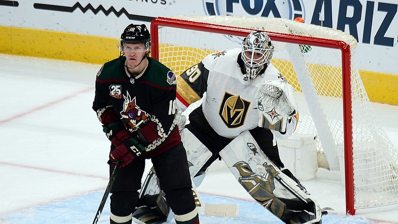 Jan 22, 2021; Glendale, Arizona, USA; Arizona Coyotes center Christian Dvorak (18) screens Vegas Golden Knights goaltender Robin Lehner (90) during the second period at Gila River Arena. Mandatory Credit: Joe Camporeale-USA TODAY Sports