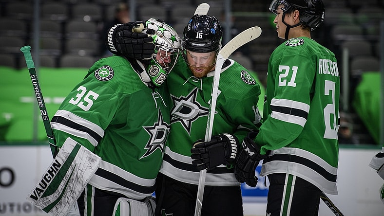 Jan 22, 2021; Dallas, Texas, USA; Dallas Stars goaltender Anton Khudobin (35) and center Joe Pavelski (16) and left wing Jason Robertson (21) celebrate the win over the Nashville Predators at the American Airlines Center. Mandatory Credit: Jerome Miron-USA TODAY Sports
