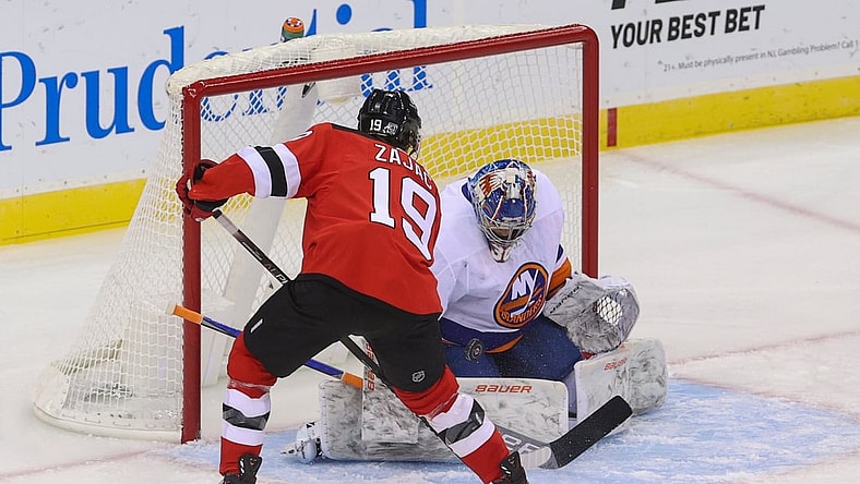 Jan 24, 2021; Newark, New Jersey, USA; New York Islanders goaltender Ilya Sorokin (30) makes a save on New Jersey Devils center Travis Zajac (19) during the first period at Prudential Center. Mandatory Credit: Ed Mulholland-USA TODAY Sports