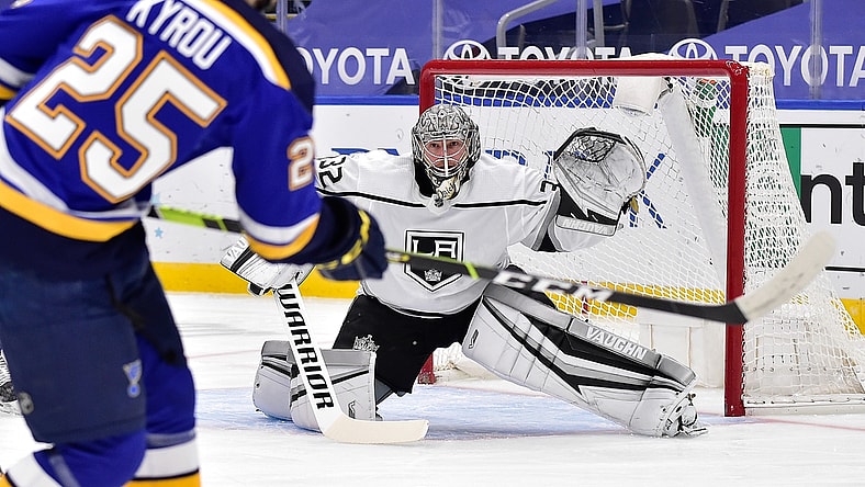 Jan 24, 2021; St. Louis, Missouri, USA;  Los Angeles Kings goaltender Jonathan Quick (32) defends the net against St. Louis Blues center Jordan Kyrou (25) during the first period at Enterprise Center. Mandatory Credit: Jeff Curry-USA TODAY Sports