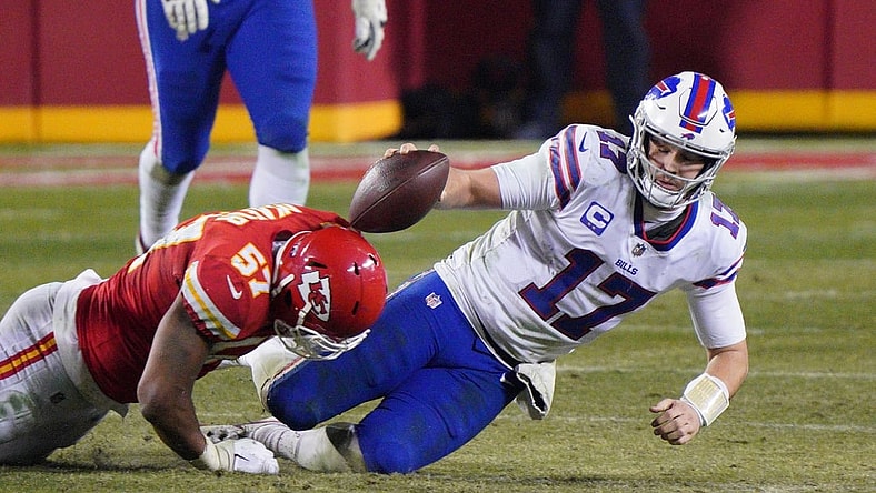 Jan 24, 2021; Kansas City, MO, USA; Buffalo Bills quarterback Josh Allen (17) is tackled by Kansas City Chiefs defensive end Alex Okafor (57) during the fourth quarter in the AFC Championship Game at Arrowhead Stadium. Mandatory Credit: Denny Medley-USA TODAY Sports