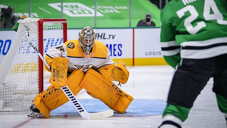 Jan 24, 2021; Dallas, Texas, USA; Nashville Predators goaltender Juuse Saros (74) faces a shot by Dallas Stars left wing Roope Hintz (24) during the second period at the American Airlines Center. Mandatory Credit: Jerome Miron-USA TODAY Sports