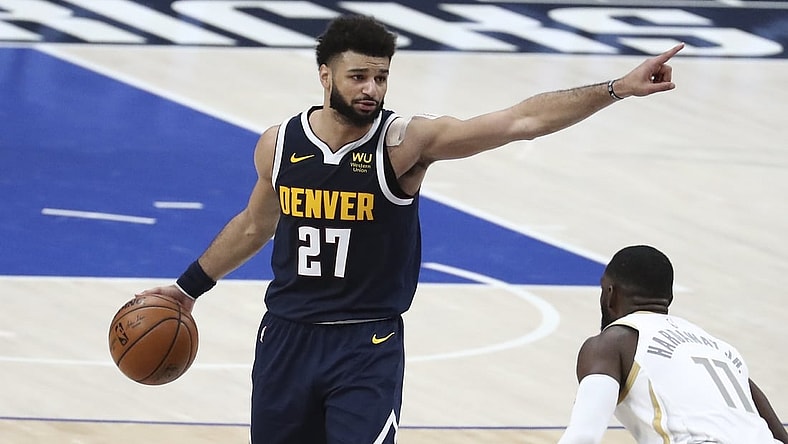 Jan 25, 2021; Dallas, Texas, USA; Denver Nuggets guard Jamal Murray (27) calls out a play as Dallas Mavericks forward Tim Hardaway Jr. (11) defends during the second half at American Airlines Center. Mandatory Credit: Kevin Jairaj-USA TODAY Sports