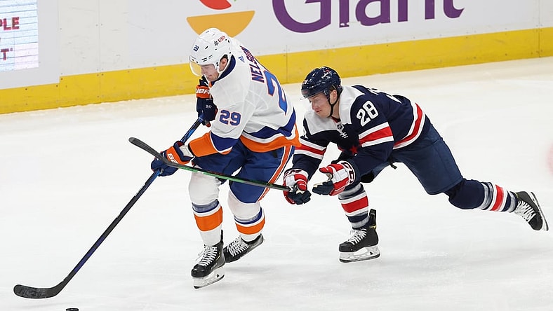 Jan 26, 2021; Washington, District of Columbia, USA; New York Islanders center Brock Nelson (29) skates with the puck as Washington Capitals left wing Daniel Carr (28 0 defends in the second period at Capital One Arena. Mandatory Credit: Geoff Burke-USA TODAY Sports