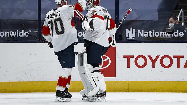 Jan 26, 2021; Columbus, Ohio, USA; Florida Panthers right wing Patric Hornqvist (70) celebrates with goaltender Sergei Bobrovsky (72) after defeating the Columbus Blue Jackets in a shootout at Nationwide Arena. Mandatory Credit: Aaron Doster-USA TODAY Sports